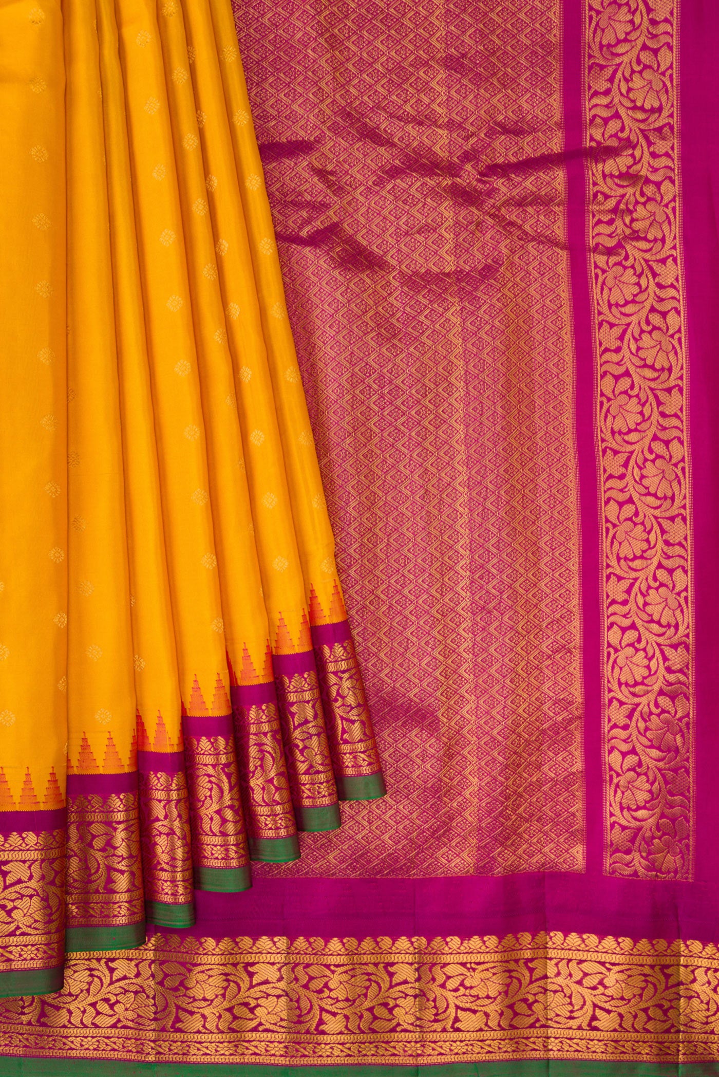 Pleats and pallu of Mustard Dual Tone Gadwal Silk Saree with Zari Butta on the body and Zari Border. 