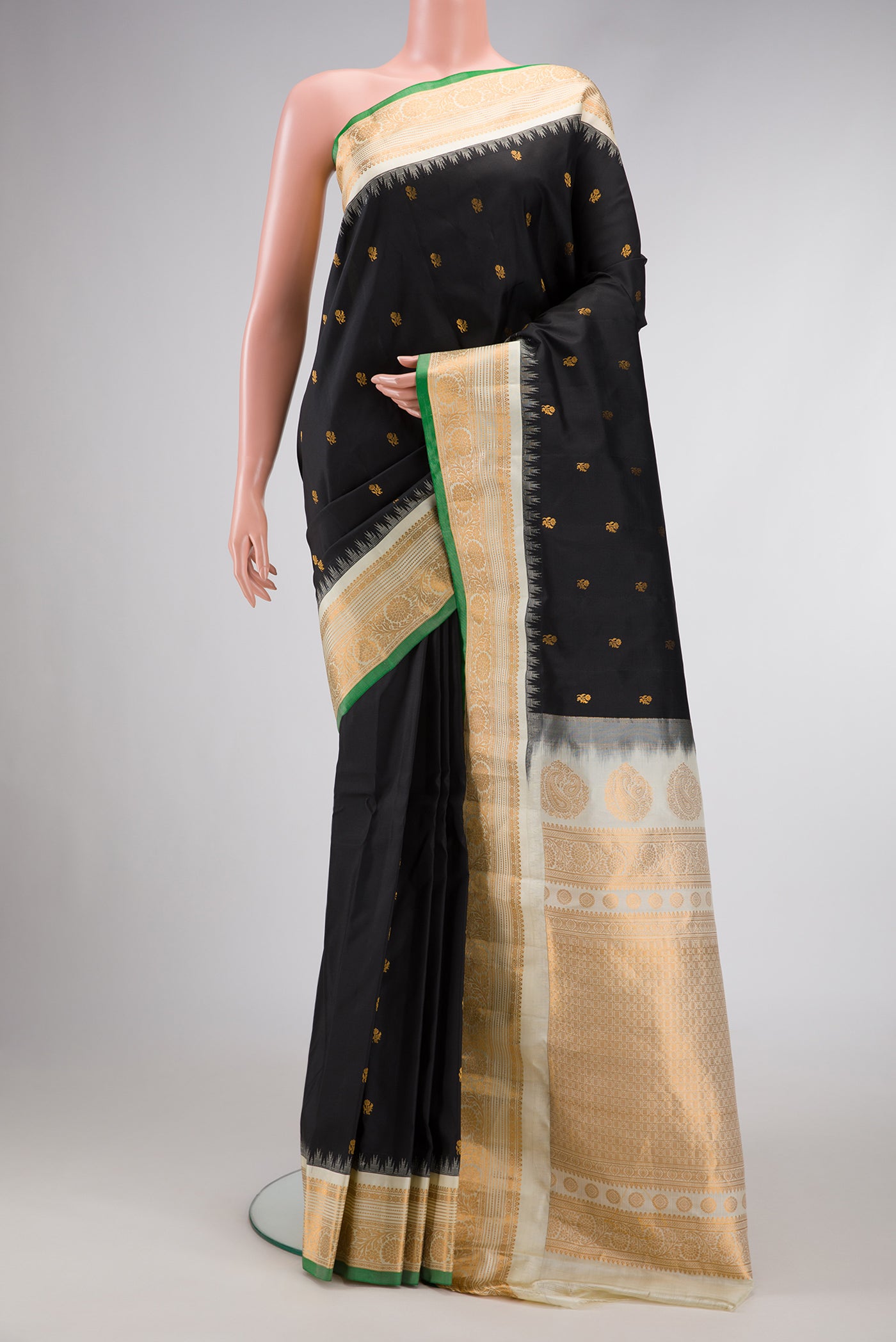 Black Dual Tone Gadwal Silk Saree with Zari Butta on the body and Zari Border.  displayed on a mannequin