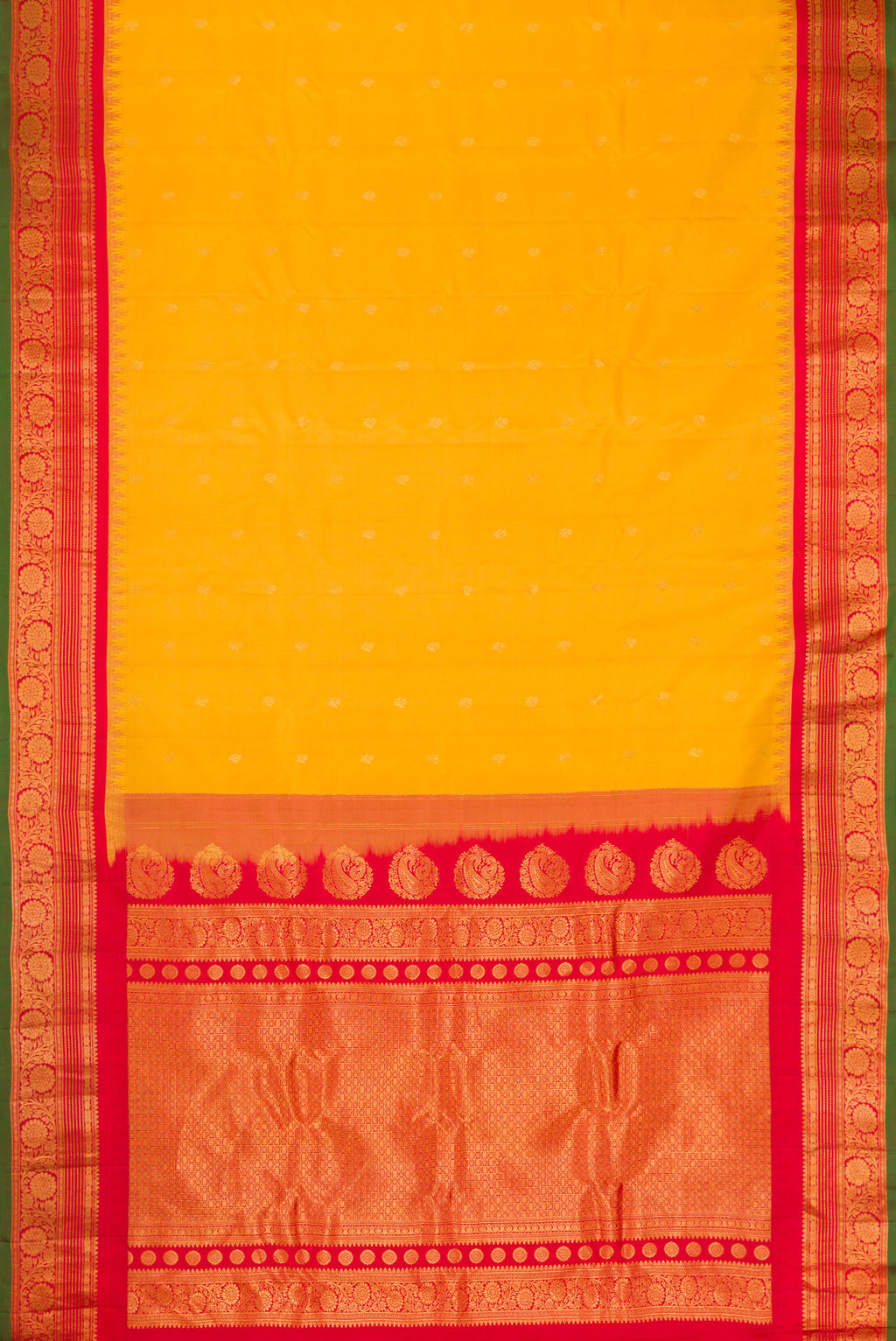 Flat view of Mustard Gadwal Silk Saree with Zari Butta on the body and Zari Border. 