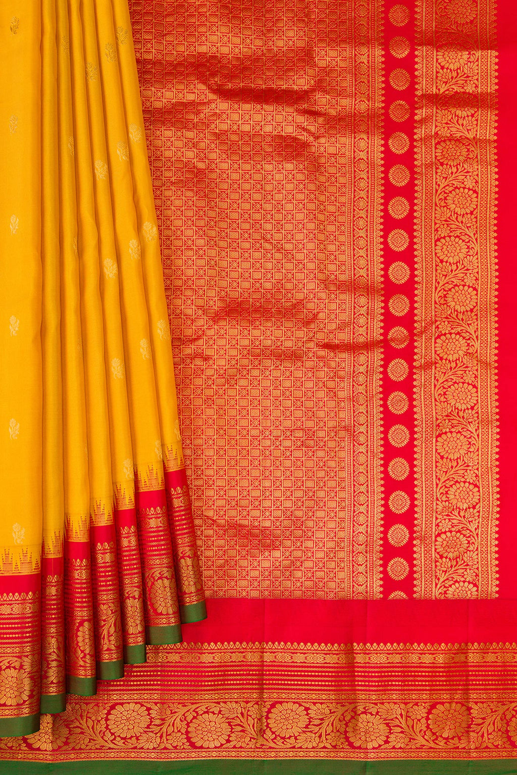 Pleats and pallu of Mustard Gadwal Silk Saree with Zari Butta on the body and Zari Border. 