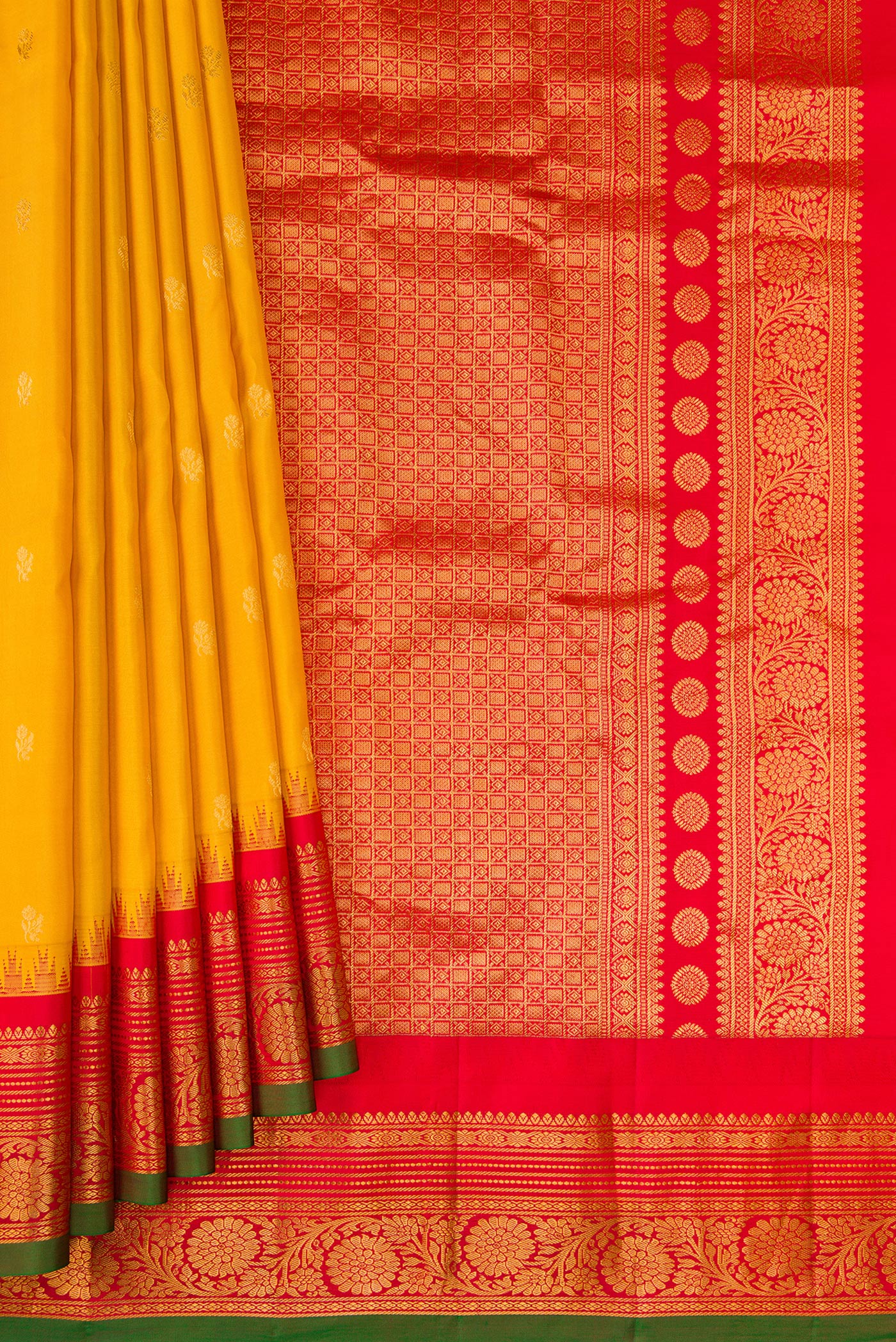 Pleats and pallu of Mustard Gadwal Silk Saree with Zari Butta on the body and Zari Border. 