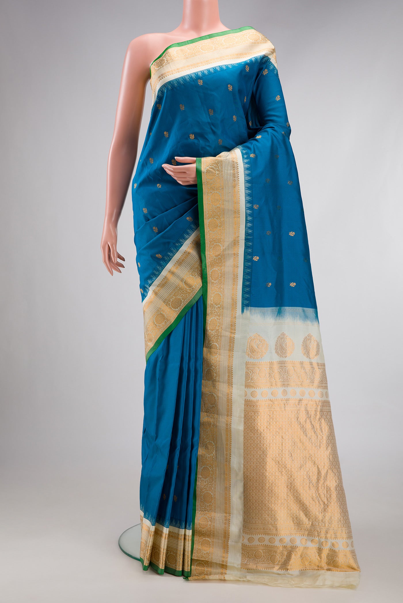 Blue Gadwal Silk Saree with Zari Butta on the body and Zari Border.  displayed on a mannequin