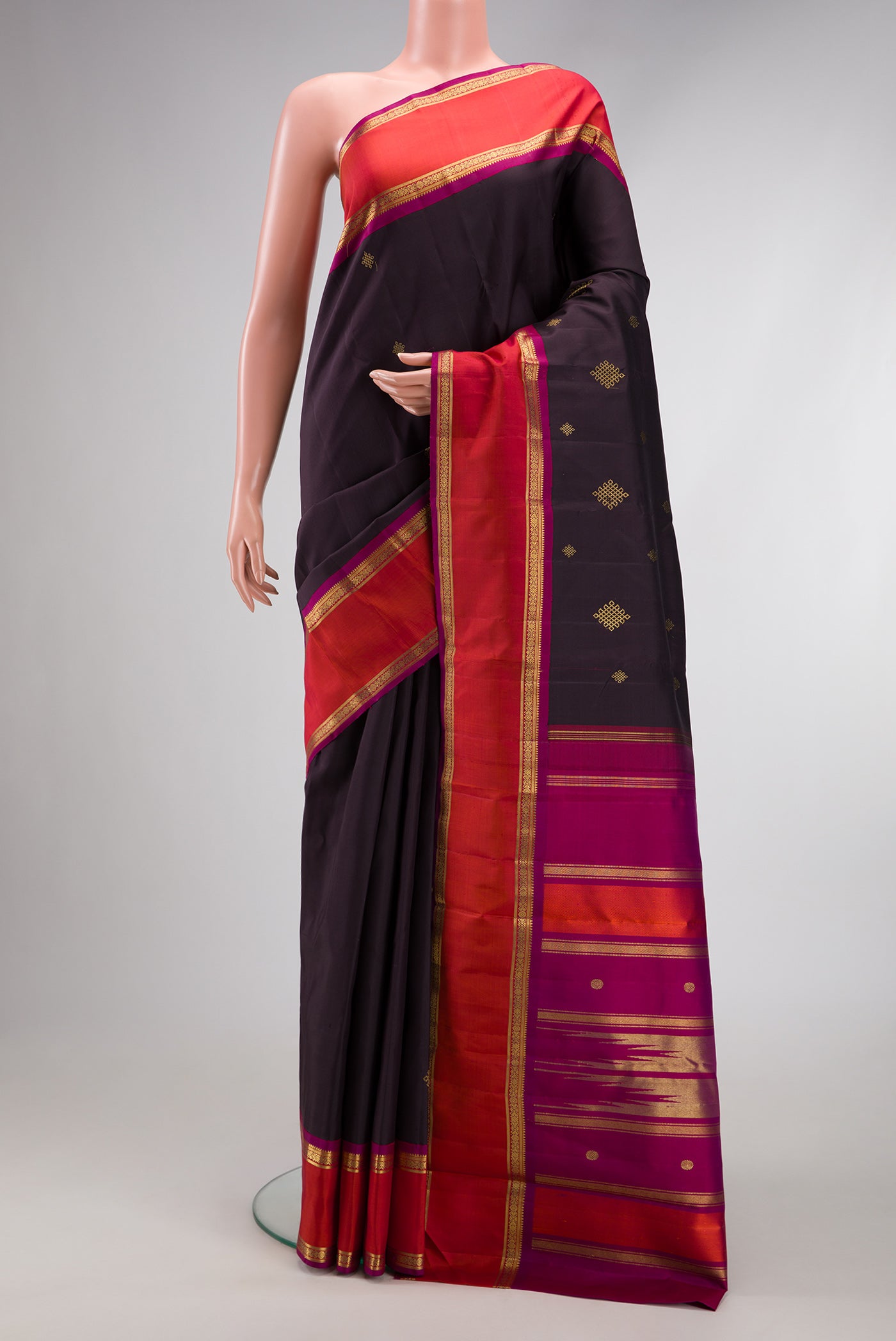 Pure Silk Pure Zari Coffee Brown Dual Tone Kanjivaram Saree with Zari Butta on the body and Zari Border.  displayed on a mannequin