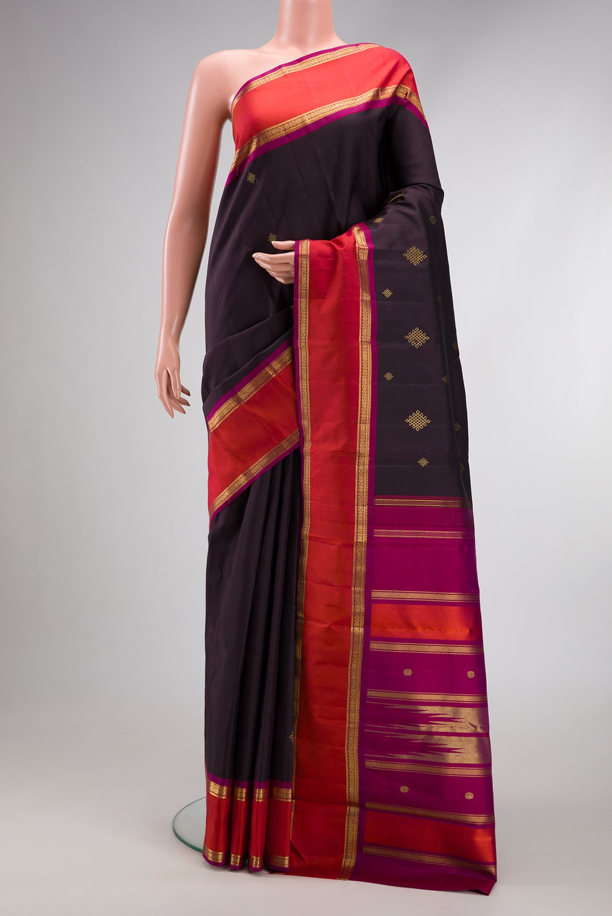 Pure Silk Pure Zari Coffee Brown Dual Tone Kanjivaram Saree with Zari Butta on the body and Zari Border.  displayed on a mannequin
