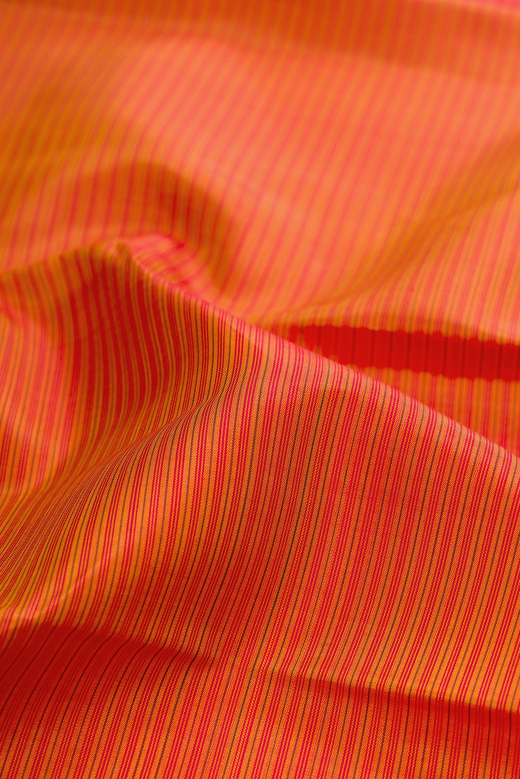 Close up of Pure Silk Pure Zari Mustard Kanjivaram Saree with Stripes on the body and Fancy Border.  displaying folds