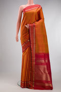 Pure Silk Pure Zari Mustard Kanjivaram Saree with Stripes on the body and Fancy Border.  displayed on a mannequin