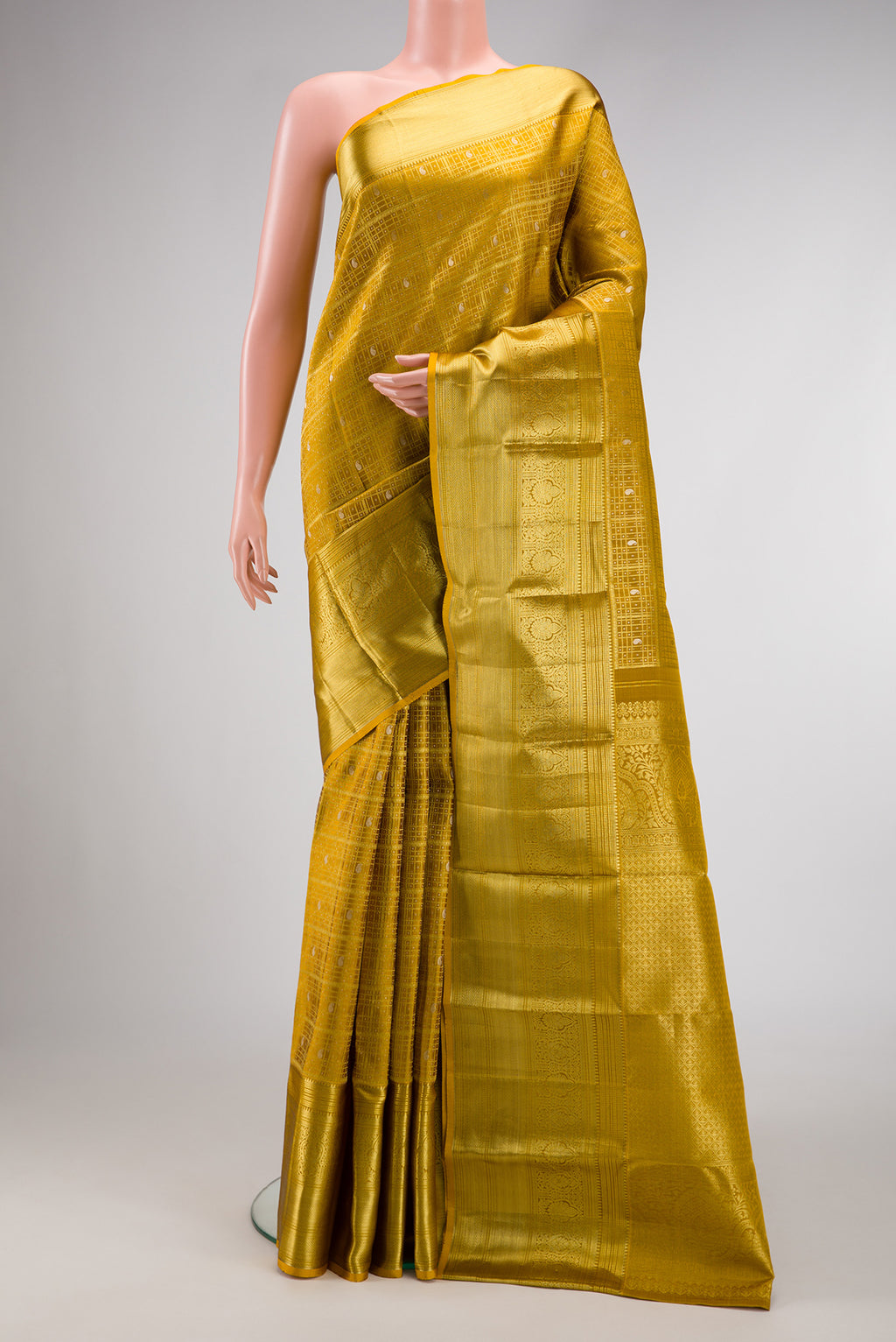 Gold Dual Tone Kanchipuram Silk Saree with Zari Brocade on the body and Zari Border.  displayed on a mannequin