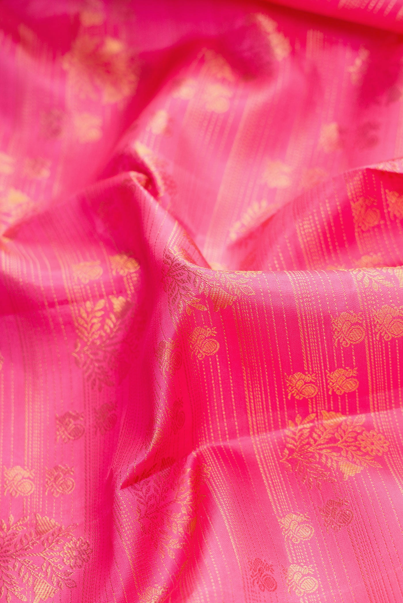 Close up of Pink Dual Tone Kanchipuram Silk Saree with Zari Brocade on the body and Zari Border.  displaying folds