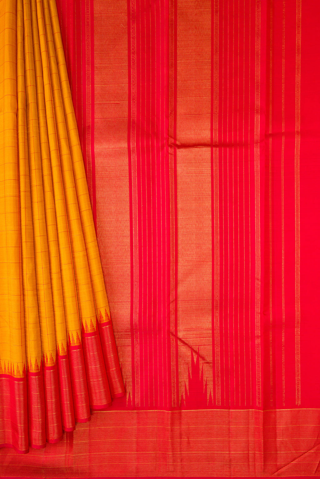 Pleats and pallu of Mustard Kanjivaram Silk Saree with Checked design on the body and Zari Border. 
