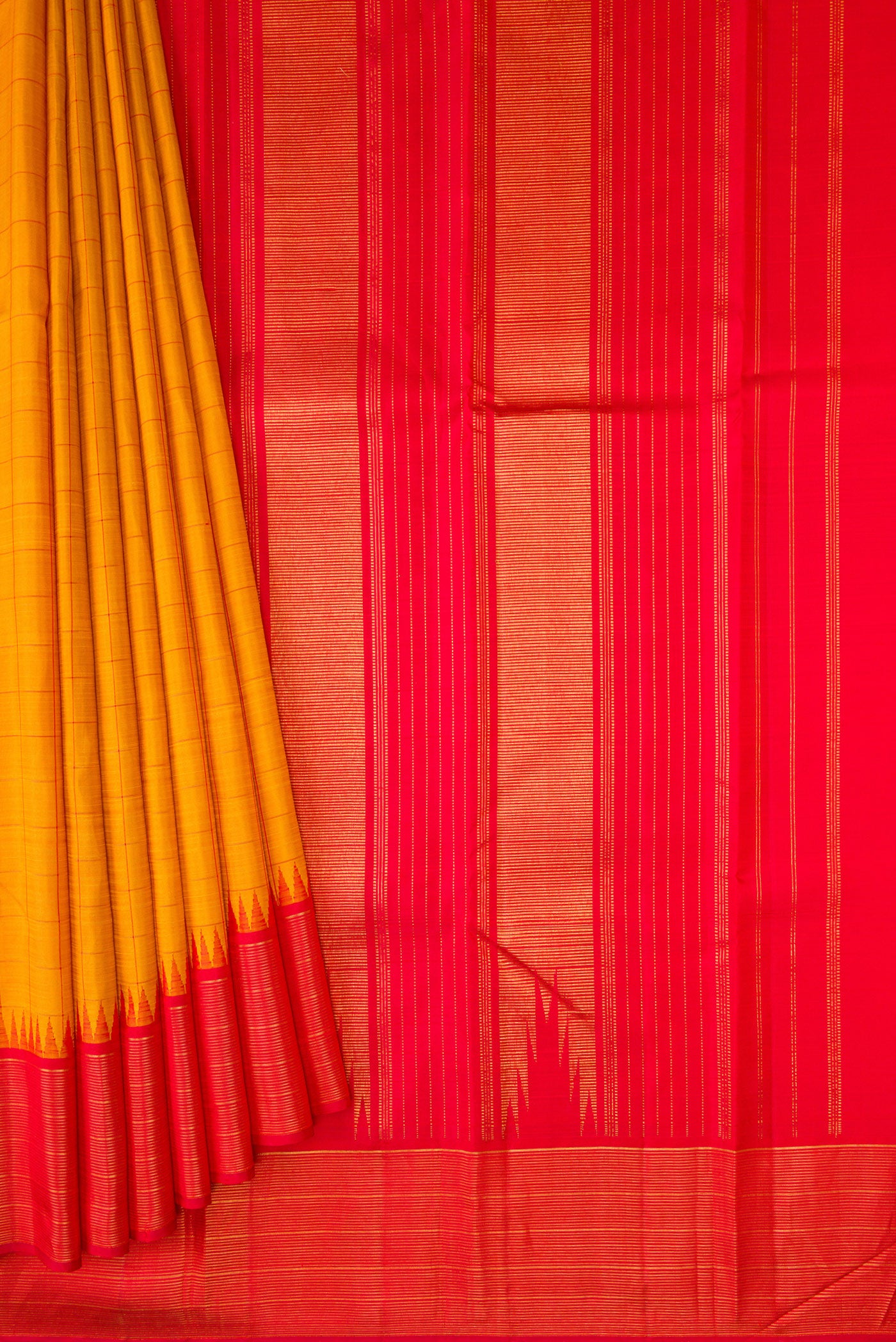 Pleats and pallu of Mustard Kanjivaram Silk Saree with Checked design on the body and Zari Border. 