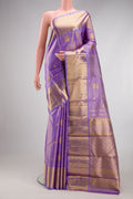 Lavender Kanchipuram Silk Saree with Zari Butta on the body and Fancy Border.  displayed on a mannequin