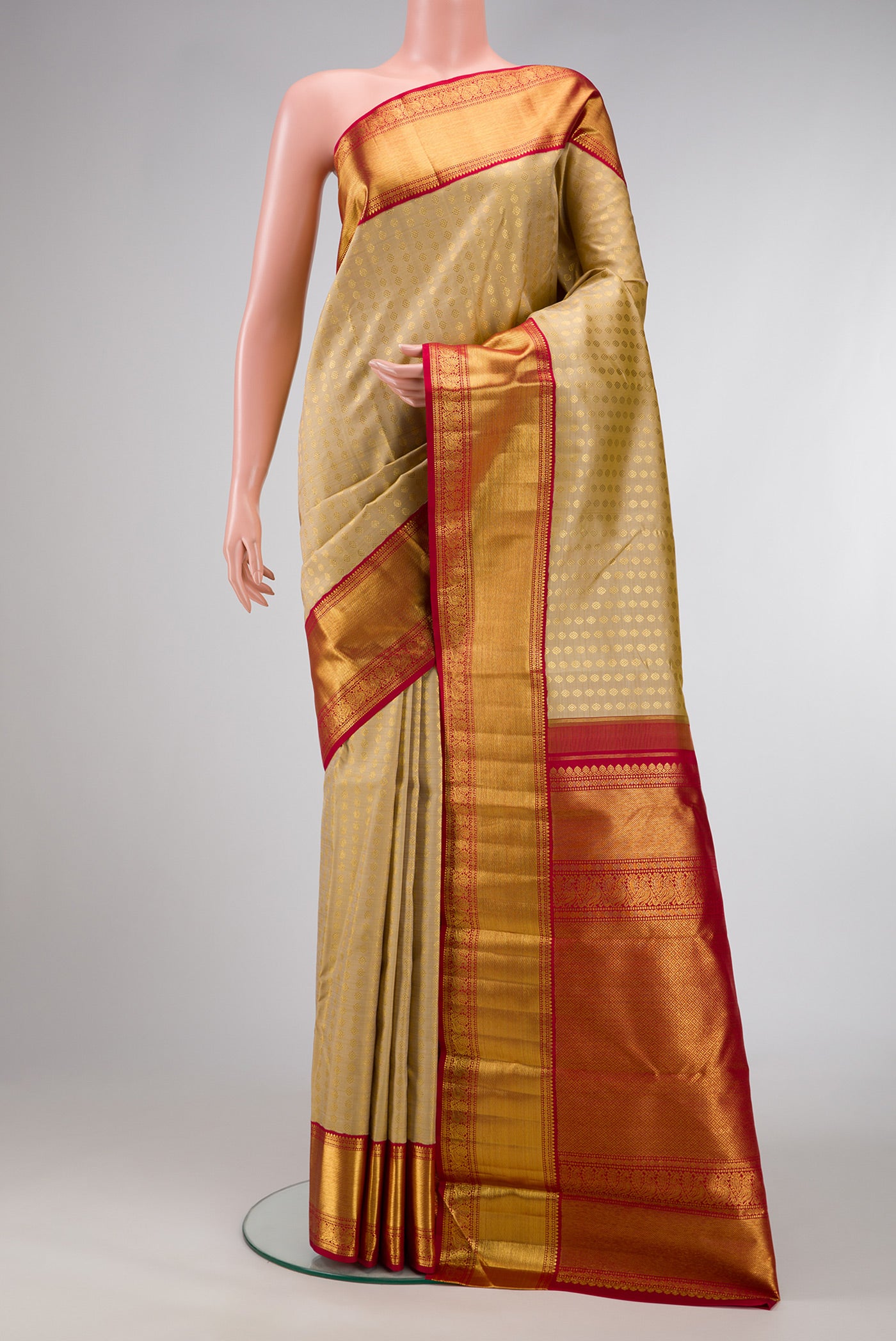 Sandal Dual Tone Kanchipuram Silk Saree with Zari Butta on the body and Zari Border.  displayed on a mannequin