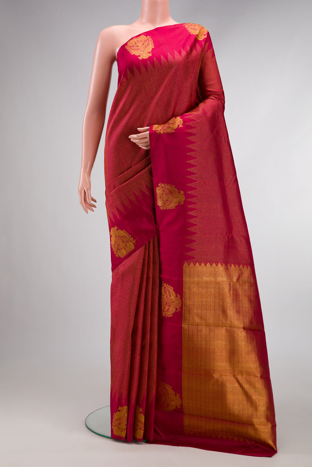 Pure Silk Pure Zari Magenta Dual Tone Kanjivaram Saree with Zari Brocade on the body and Fancy Border.  displayed on a mannequin