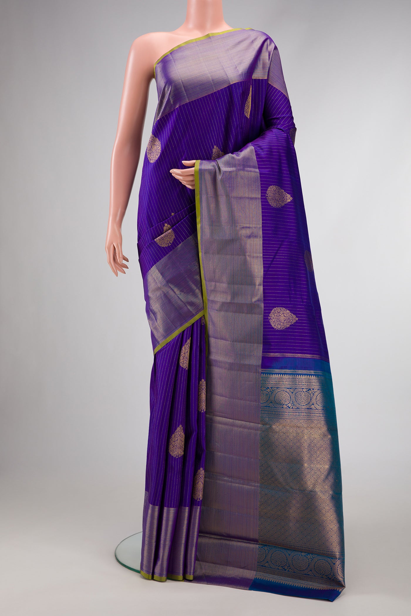 Royal Blue Dual Tone Kanjivaram Silk Saree with Zari Butta on the body and Zari Border.  displayed on a mannequin