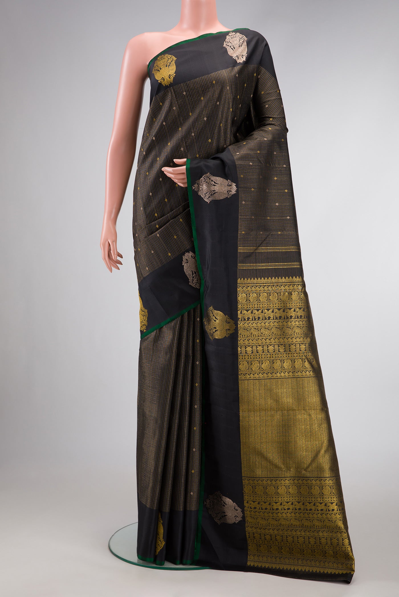 Pure Silk Pure Zari Black Dual Tone Kanjivaram Saree with Zari Butta on the body and Zari Border.  displayed on a mannequin