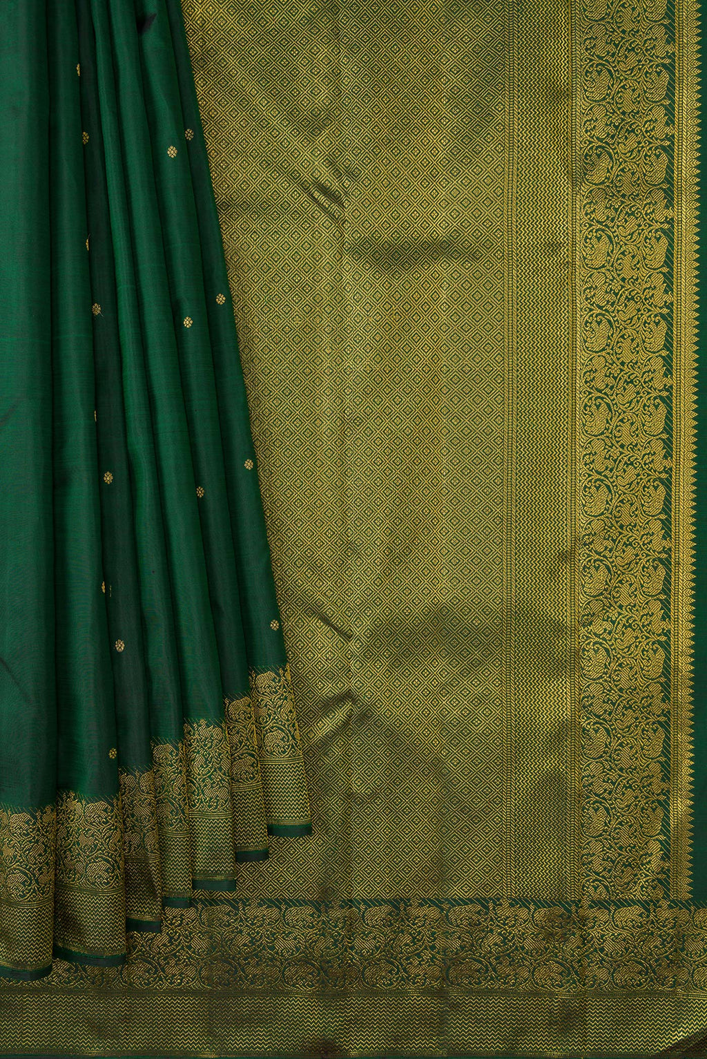 Pleats and pallu of Green Dual Tone Kanjivaram Silk Saree with Zari Butta on the body and Zari Border. 
