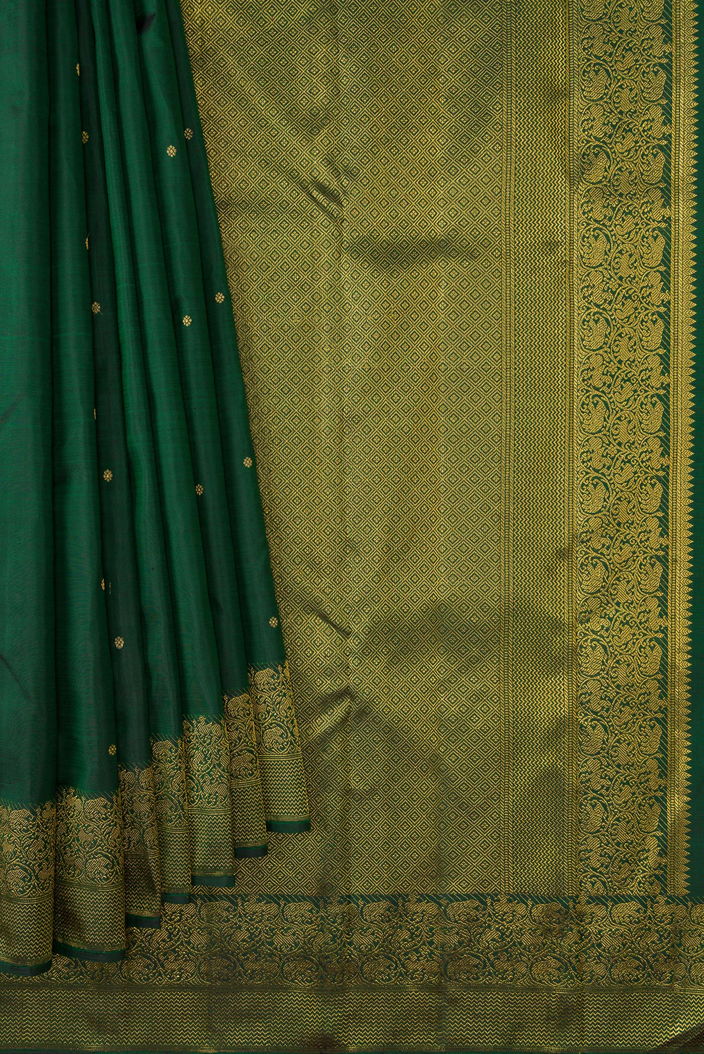 Pleats and pallu of Green Dual Tone Kanjivaram Silk Saree with Zari Butta on the body and Zari Border. 