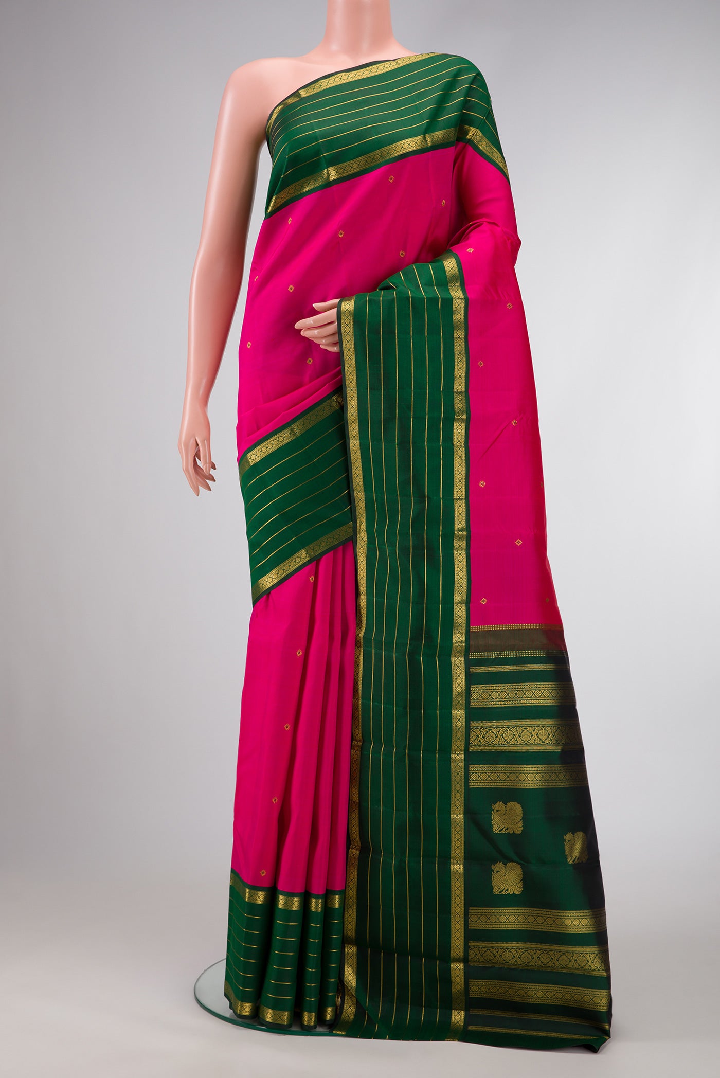 Dark Pink Dual Tone Kanchipuram Silk Saree with Zari Butta on the body and Zari Border.  displayed on a mannequin