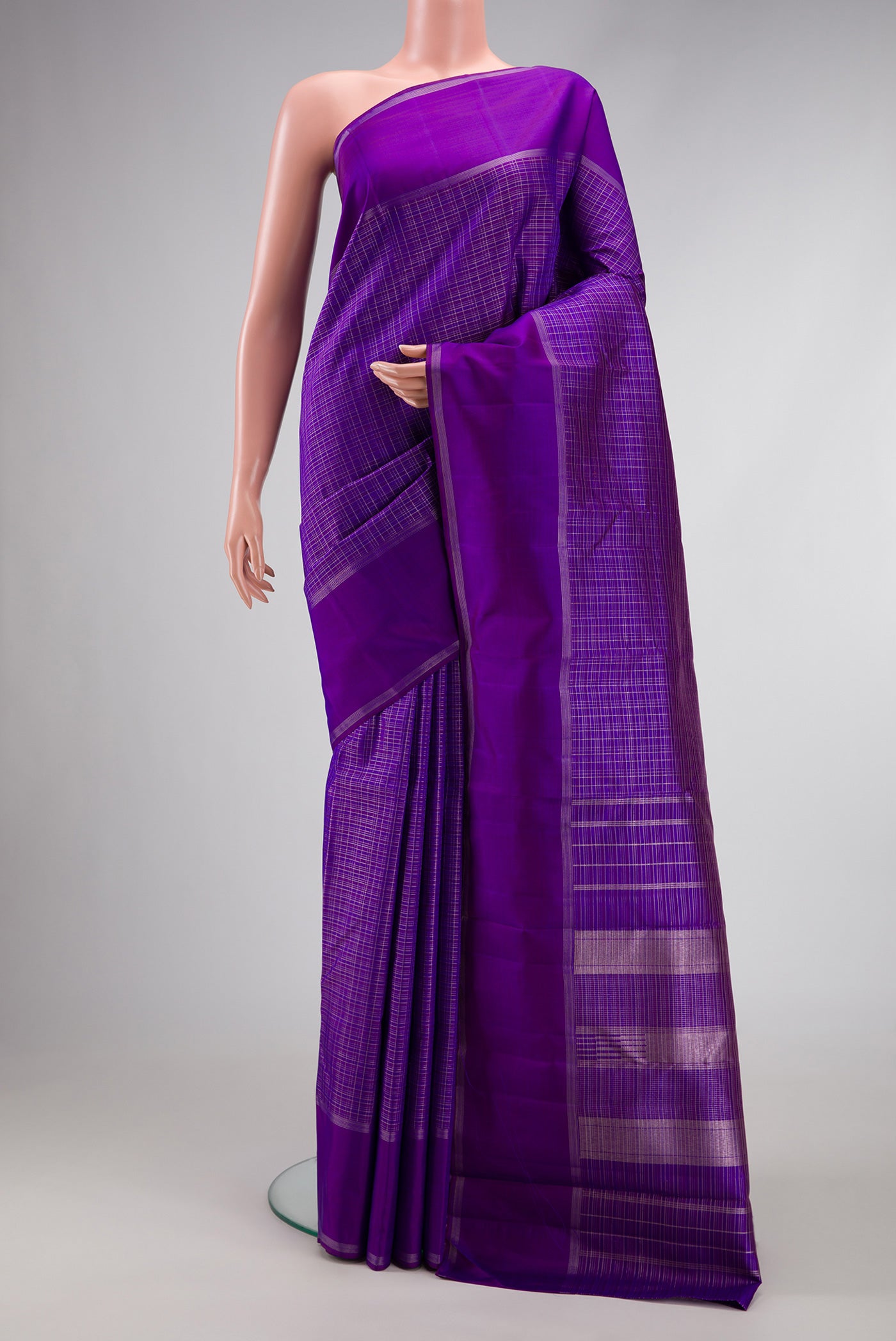 Royal Blue Dual Tone Kanchipuram Silk Saree with Checked design on the body and Zari Border.  displayed on a mannequin