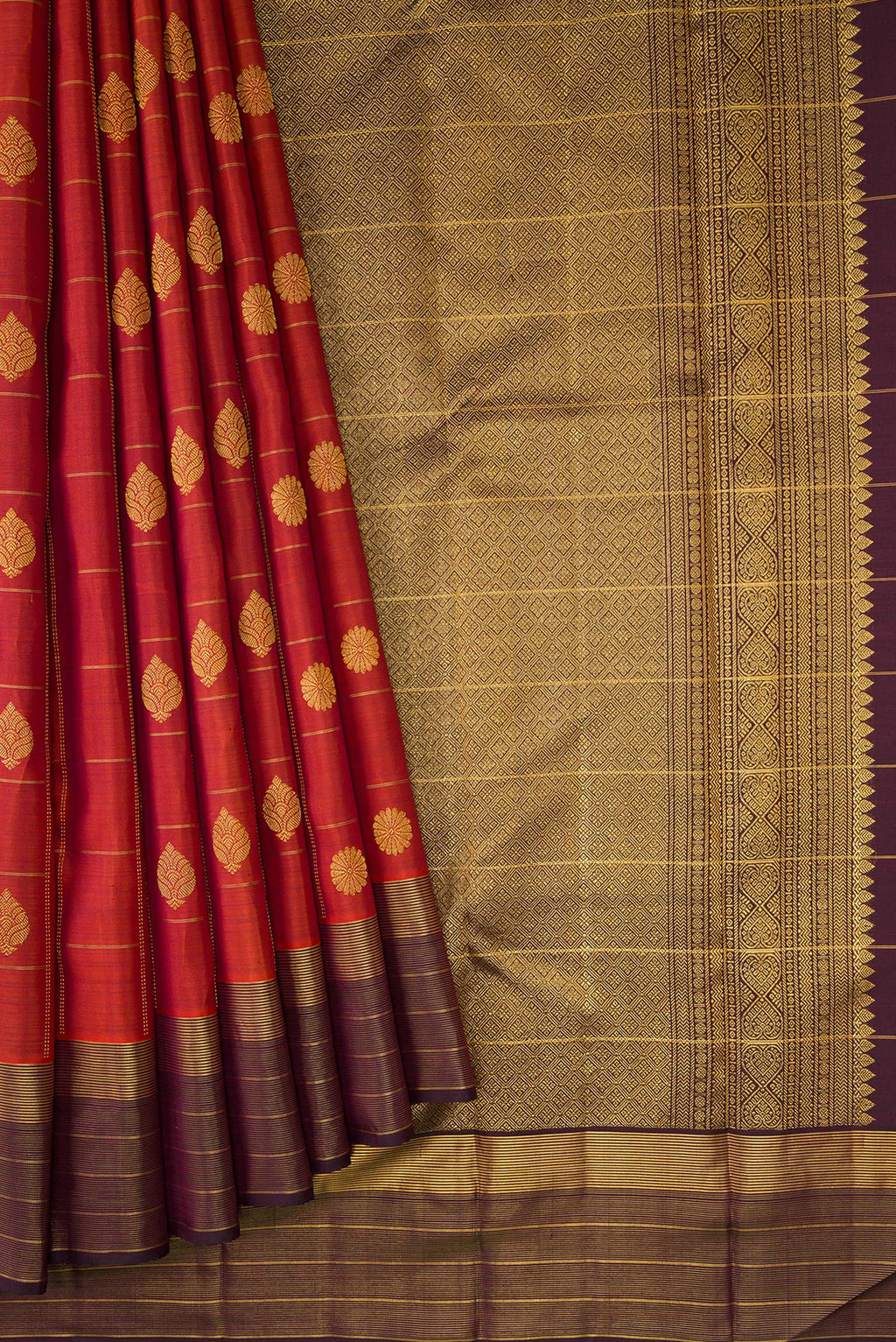 Pleats and pallu of Brick Orange Dual Tone Kanjivaram Silk Saree with Checked design on the body and Zari Border. 