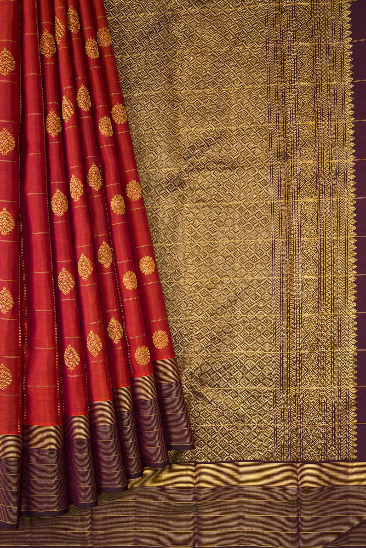 Pleats and pallu of Brick Orange Dual Tone Kanjivaram Silk Saree with Checked design on the body and Zari Border. 