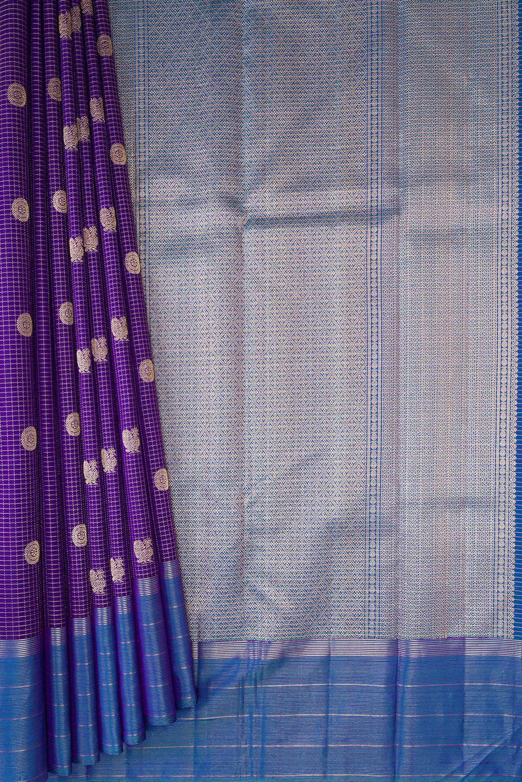 Pleats and pallu of Violet Kanjivaram Silk Saree with Stripes on the body and Zari Border. 