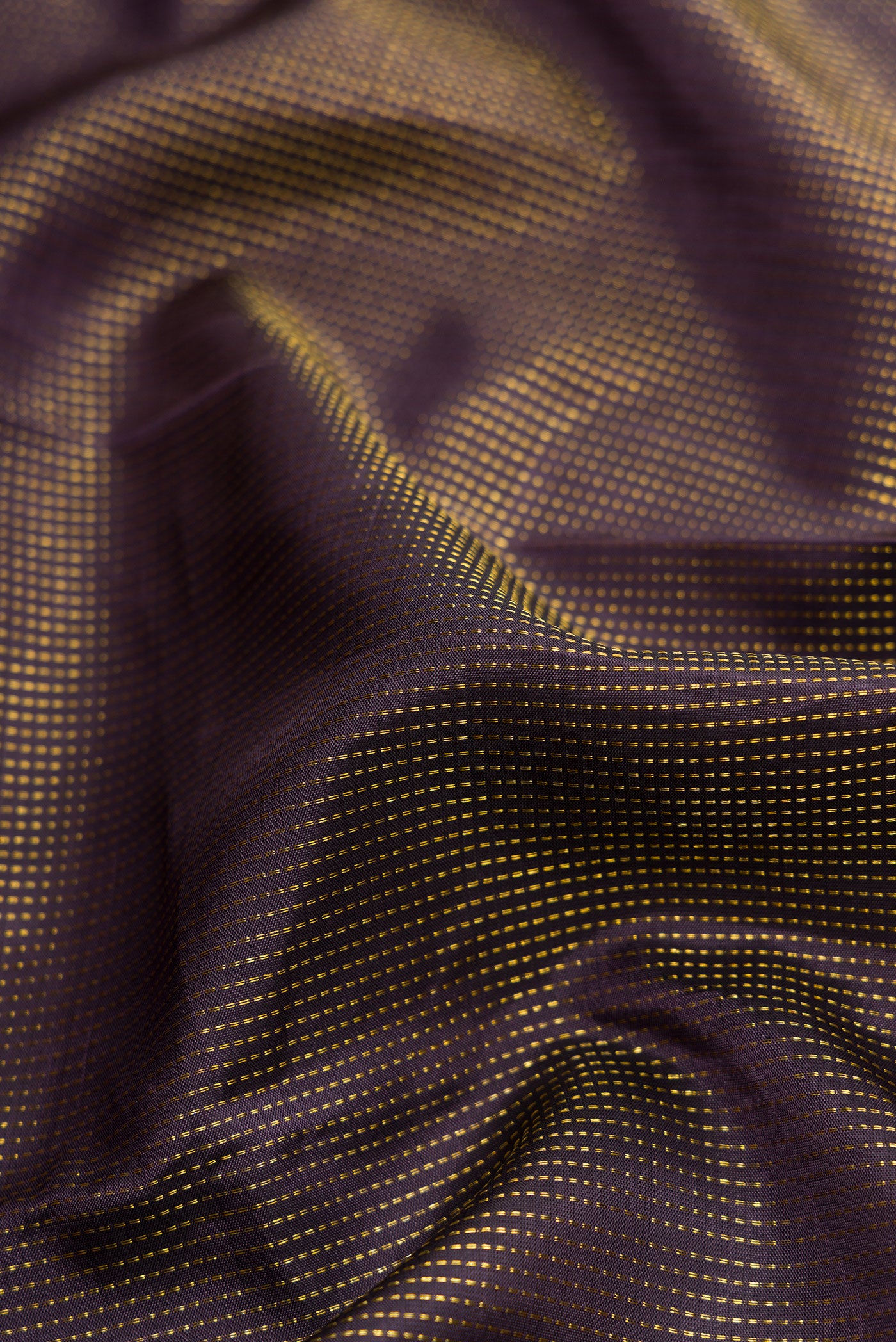 Close up of Navy Blue Dual Tone Kanjivaram Silk Saree with Stripes on the body and Fancy Border.  displaying folds