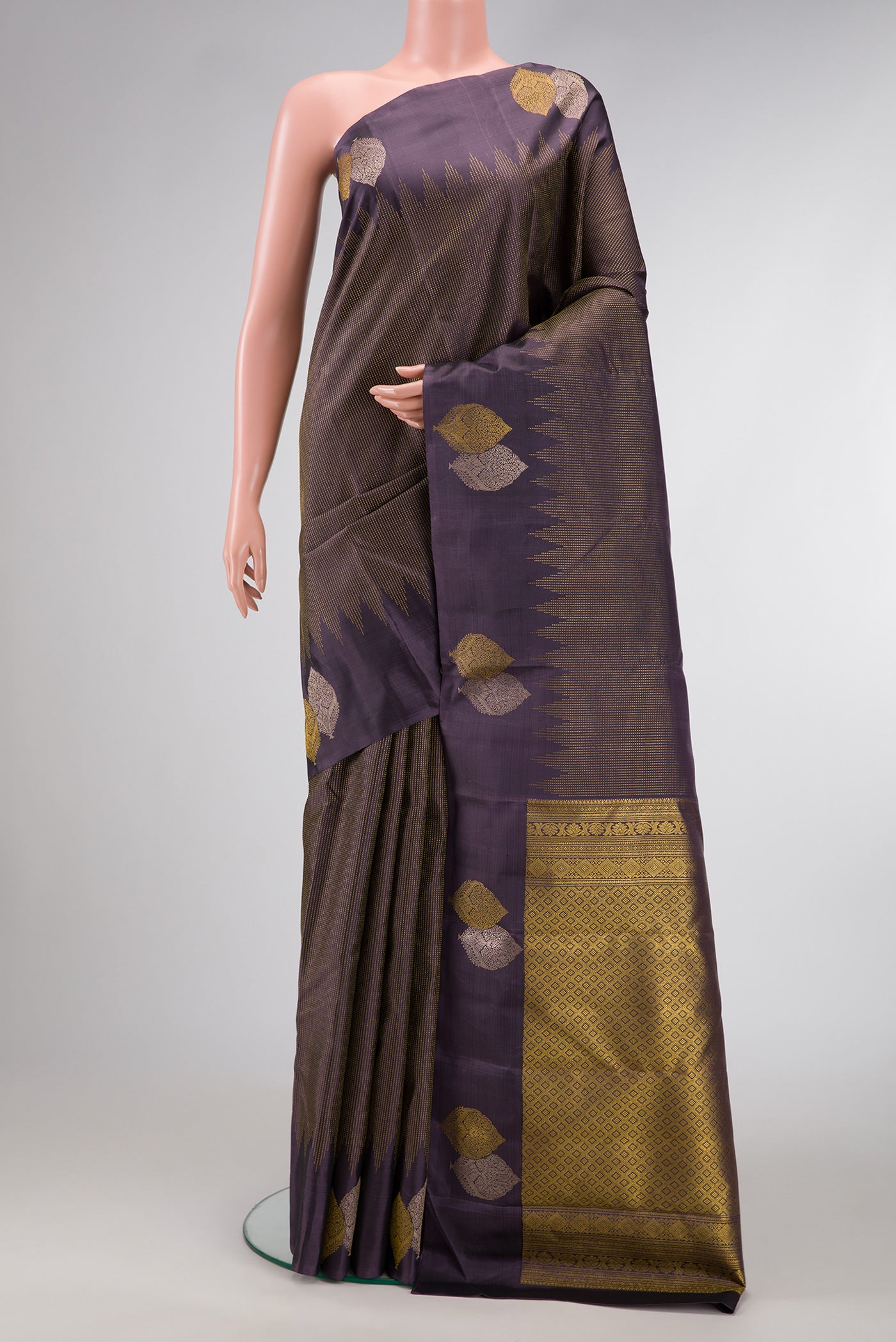 Navy Blue Dual Tone Kanjivaram Silk Saree with Stripes on the body and Fancy Border.  displayed on a mannequin