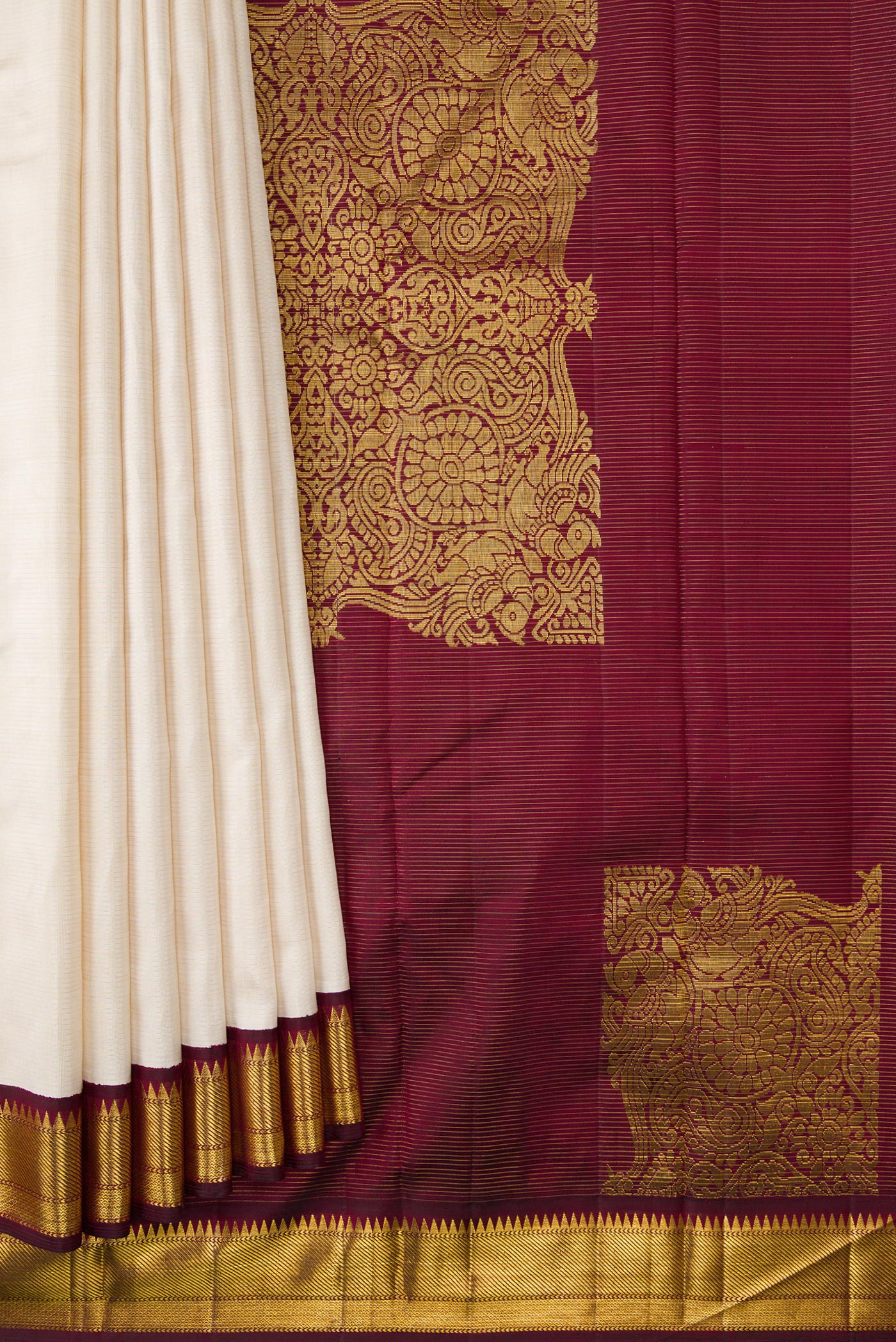 Pleats and pallu of Pure Silk Pure Zari Off White Dual Tone Kanchipuram Saree with Stripes on the body and Zari Border. 