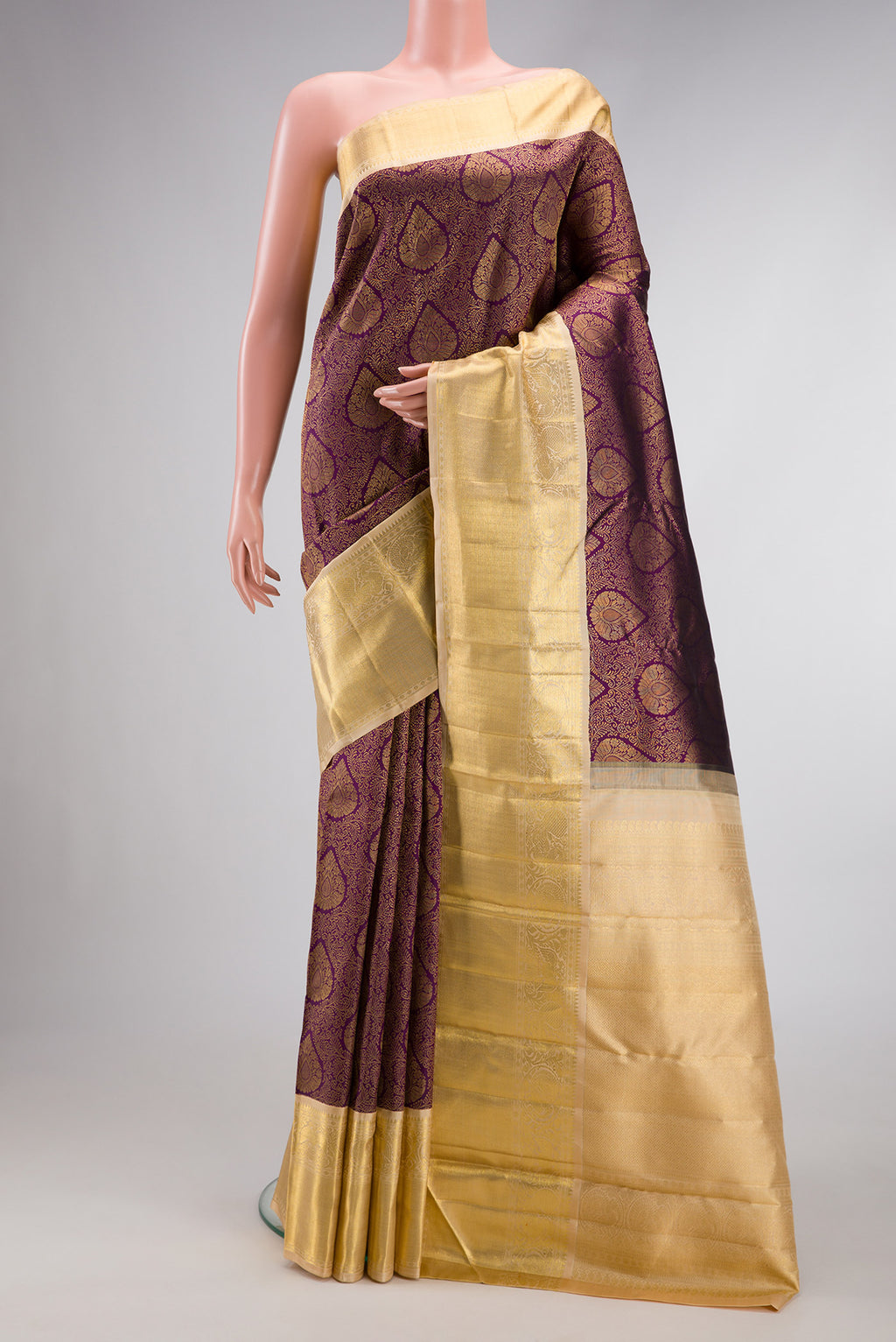 Pure Silk Pure Zari Purple Dual Tone Kanjivaram Saree with Zari Brocade on the body and Zari Border.  displayed on a mannequin