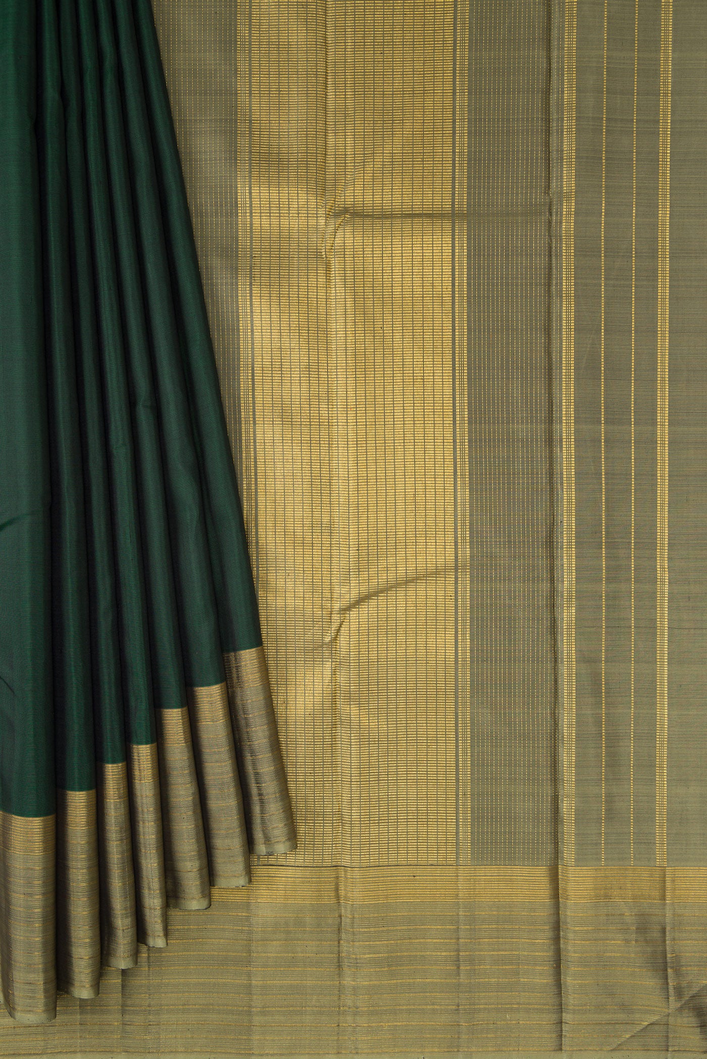 Pleats and pallu of Bottle Green Dual Tone Kanjivaram Silk Saree with Plain Body and Zari Border. 