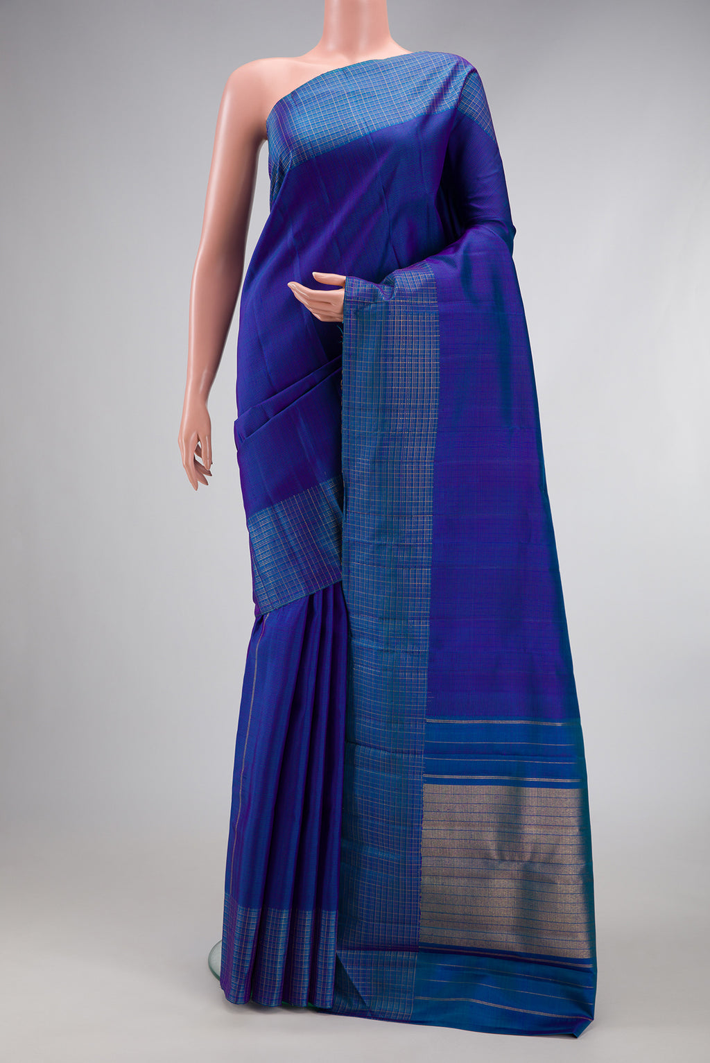 Royal Blue Kanjivaram Silk Saree with Stripes on the body and Checks Border.  displayed on a mannequin