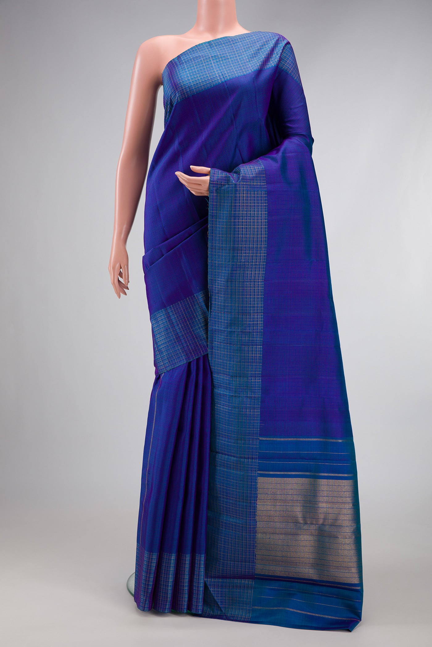 Royal Blue Kanjivaram Silk Saree with Stripes on the body and Checks Border.  displayed on a mannequin