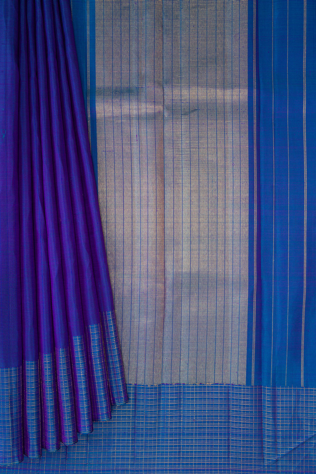 Pleats and pallu of Royal Blue Kanjivaram Silk Saree with Stripes on the body and Checks Border. 