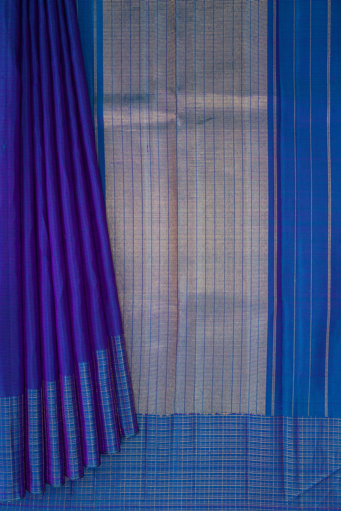Pleats and pallu of Royal Blue Kanjivaram Silk Saree with Stripes on the body and Checks Border. 
