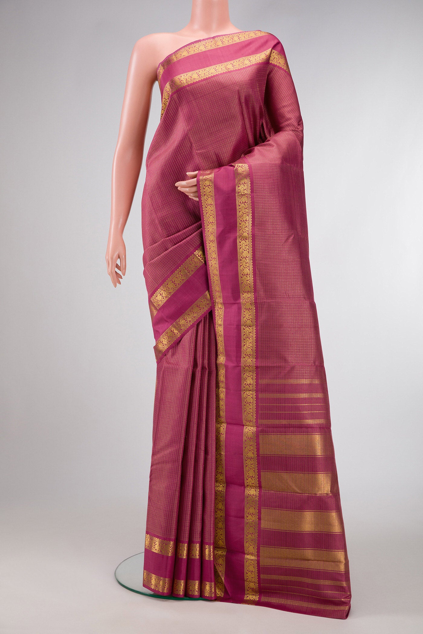 Pink Dual Tone Kanjivaram Silk Saree with Checked design on the body and Zari Border.  displayed on a mannequin
