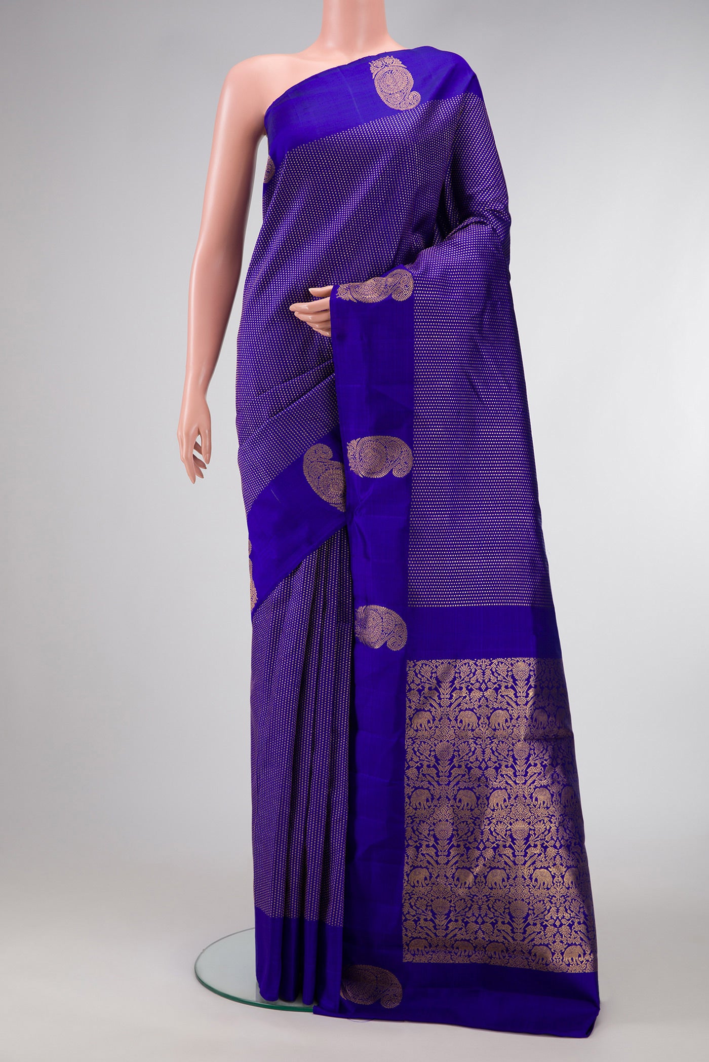 Royal Blue Dual Tone Kanjivaram Silk Saree with Stripes on the body and Fancy Border.  displayed on a mannequin