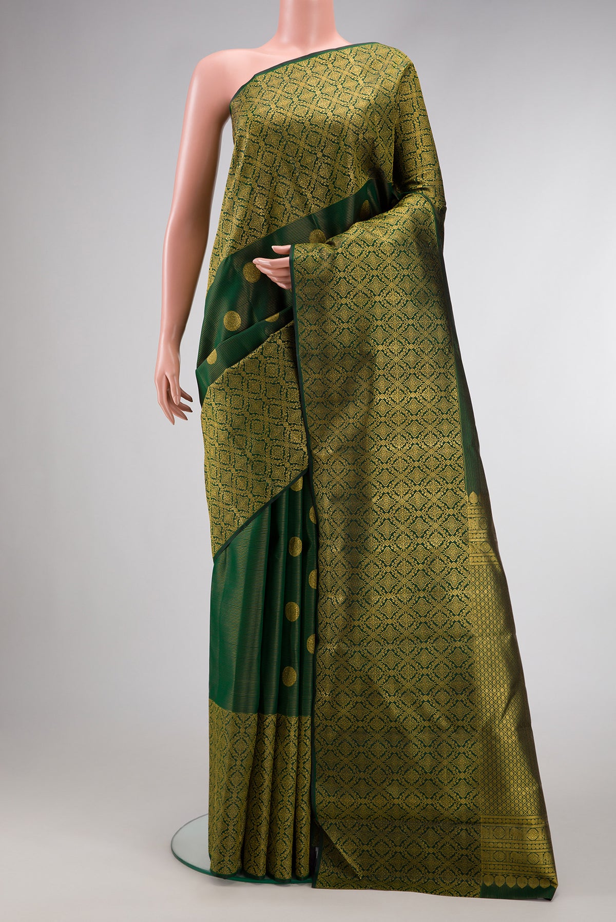 Green Dual Tone Kanchipuram Silk Saree with Zari Butta on the body and Zari Border.  displayed on a mannequin