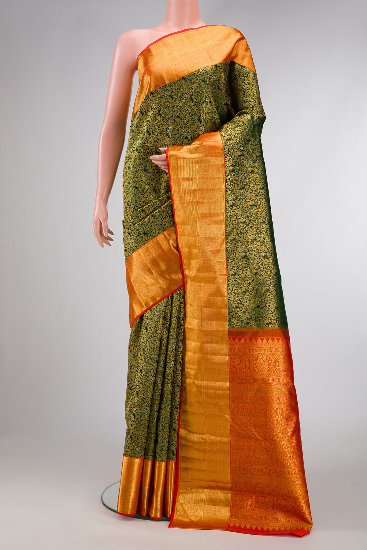 Bottle Green Dual Tone Kanchipuram Silk Saree with Zari Brocade on the body and Zari Border.  displayed on a mannequin