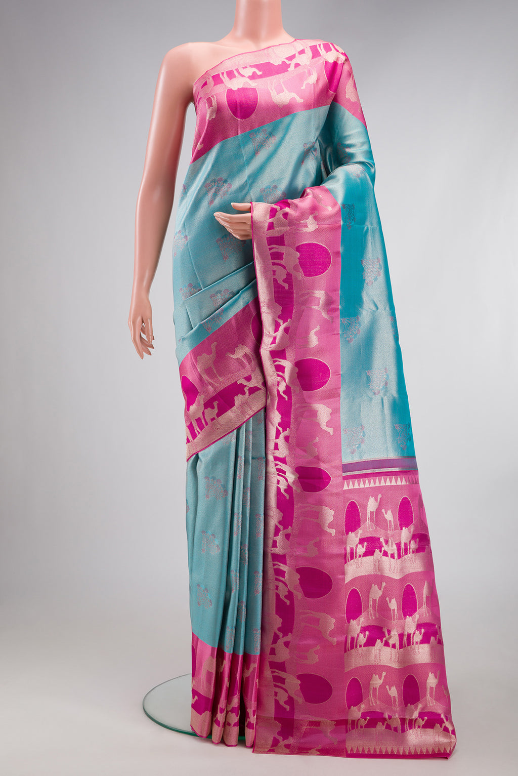 Sky Blue Dual Tone Kanjivaram Tissue Silk Saree with Zari Brocade on the body and Fancy Border.  displayed on a mannequin