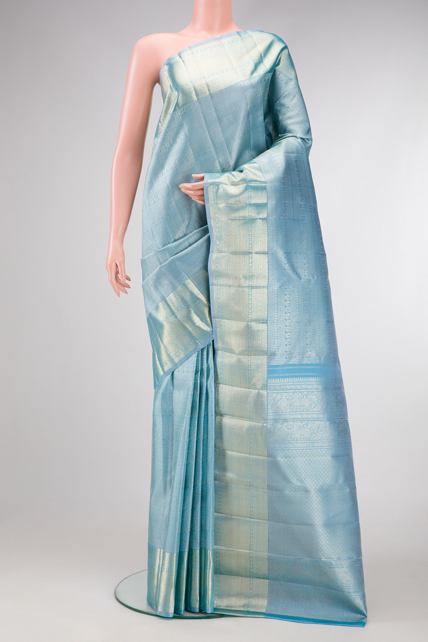 Sky Blue Dual Tone Kanchipuram Silk Saree with Zari Brocade on the body and Zari Border.  displayed on a mannequin