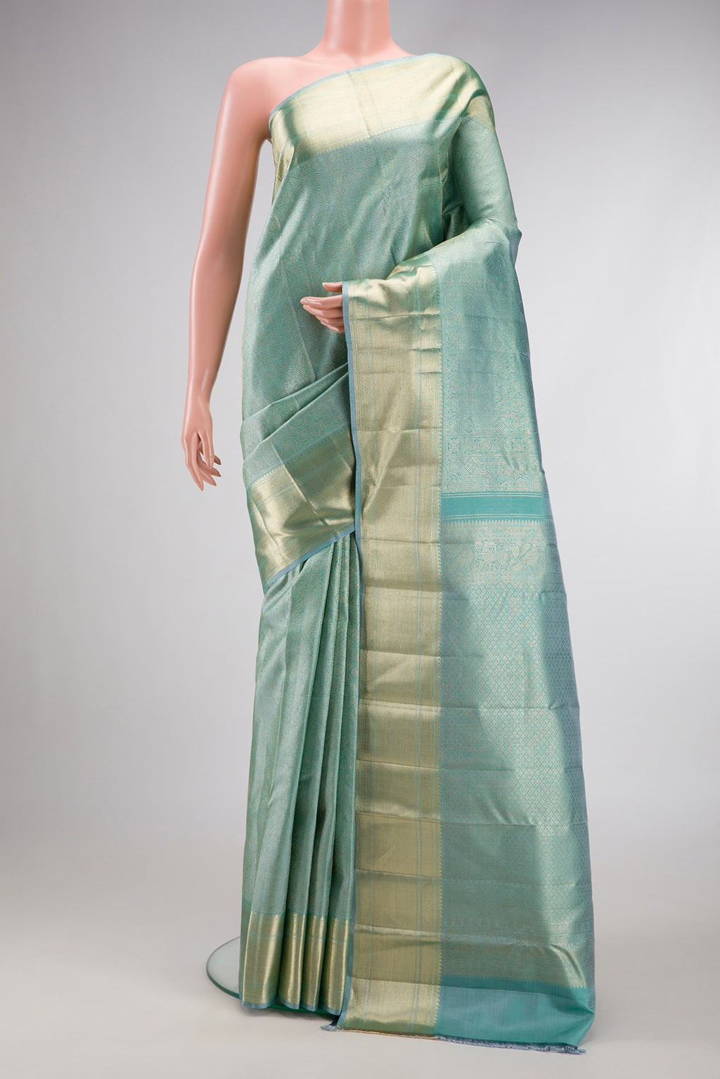 Sky Blue Dual Tone Kanchipuram Silk Saree with Zari Brocade on the body and Zari Border.  displayed on a mannequin