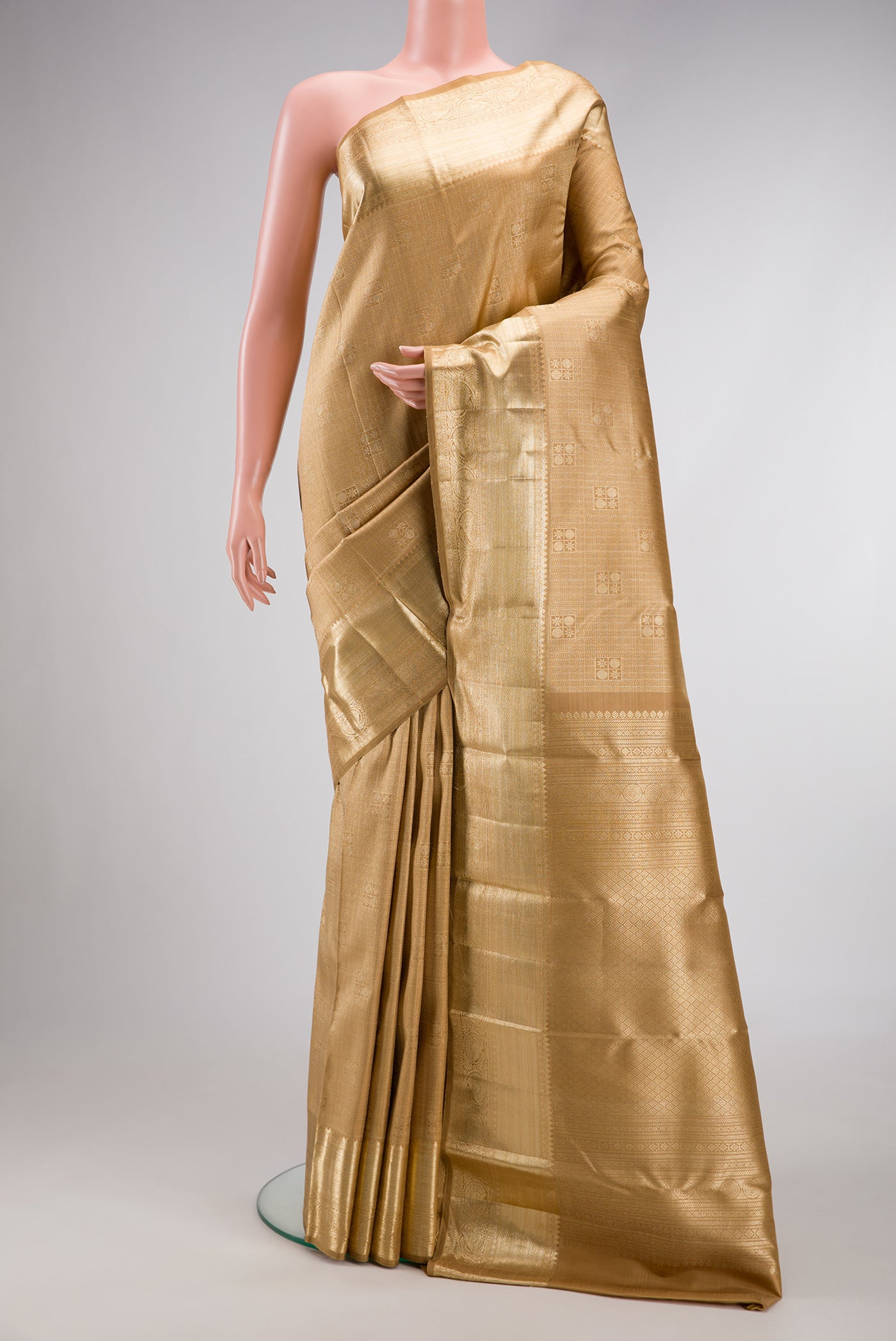 Dark Beige Dual Tone Kanchipuram Silk Saree with Zari Brocade on the body and Zari Border.  displayed on a mannequin