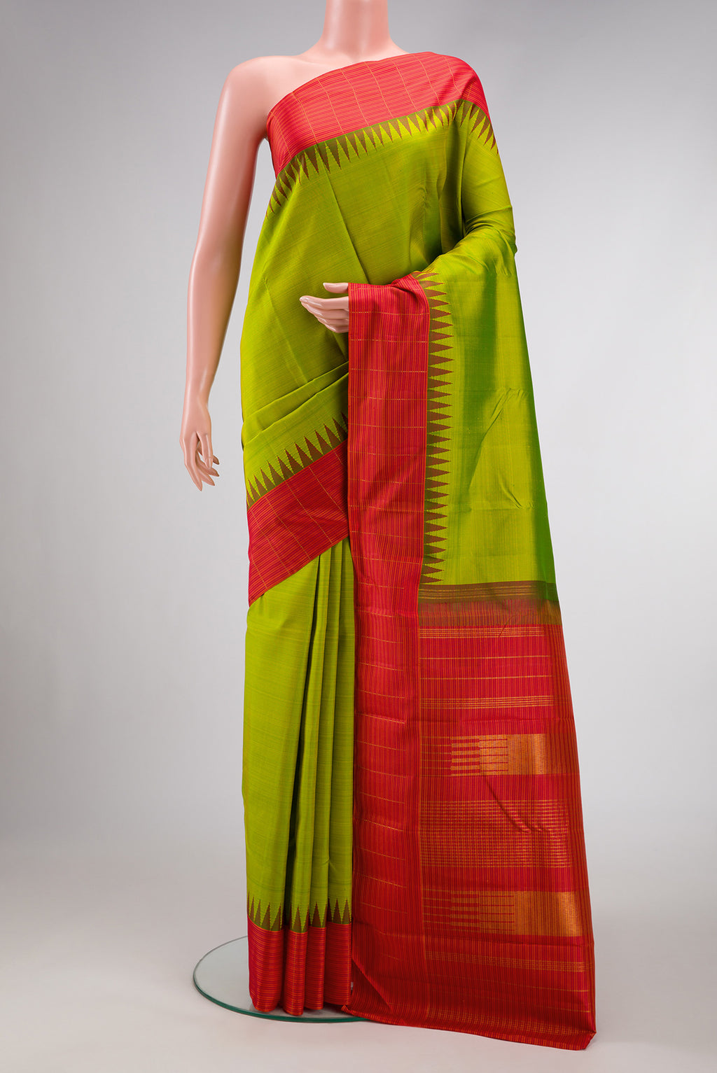 Pure Silk Pure Zari Parrot Green Dual Tone Kanjivaram Saree with Plain Body and Temple Border.  displayed on a mannequin