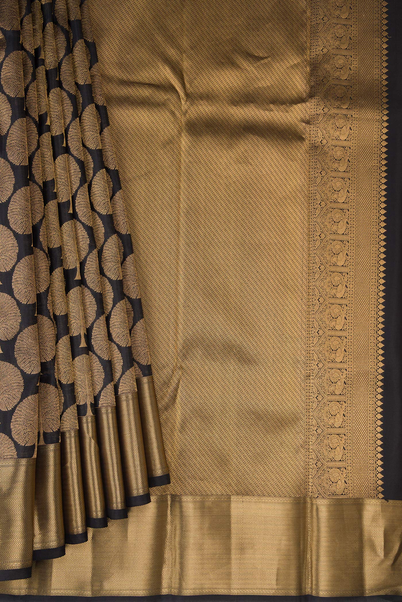 Pleats and pallu of Black Kanjivaram Silk Saree with Zari Brocade on the body and Zari Border. 