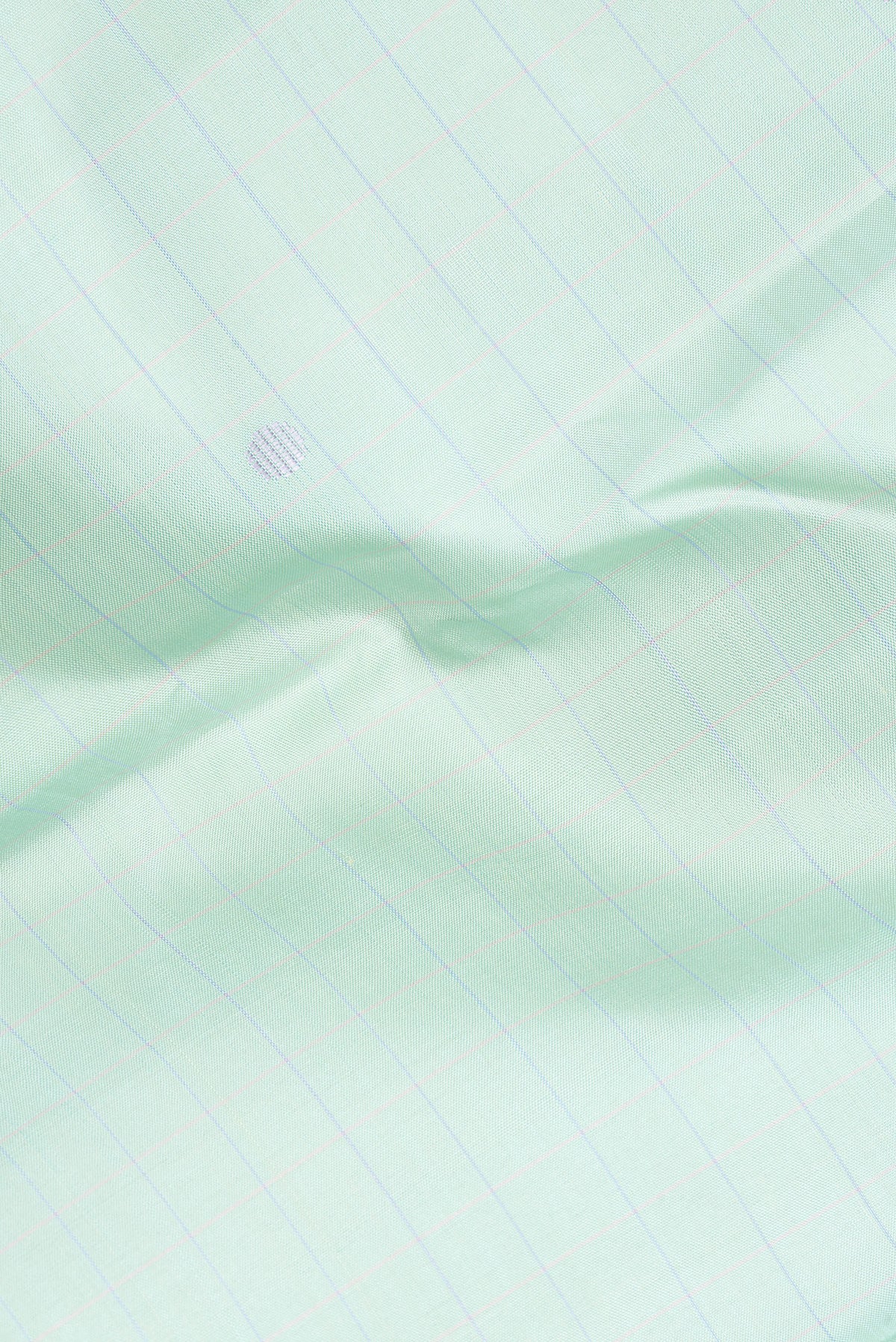 Close up of Pure Silk Pista Green Dual Tone Kanjivaram Saree with Checked design on the body and Plain Border.  displaying folds
