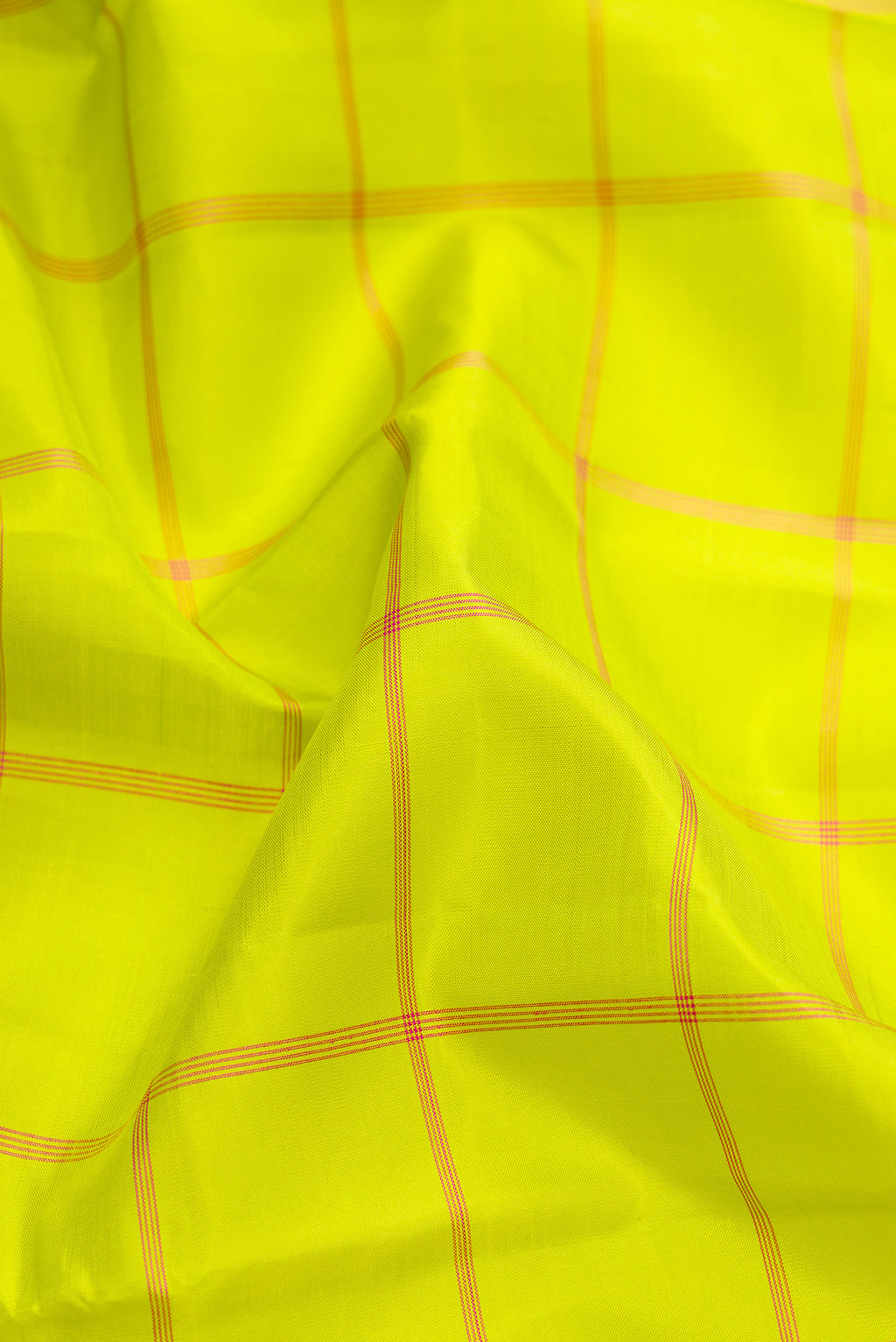 Close up of Parrot Green Dual Tone Kanjivaram Silk Saree with Checked design on the body and Without Border.  displaying folds