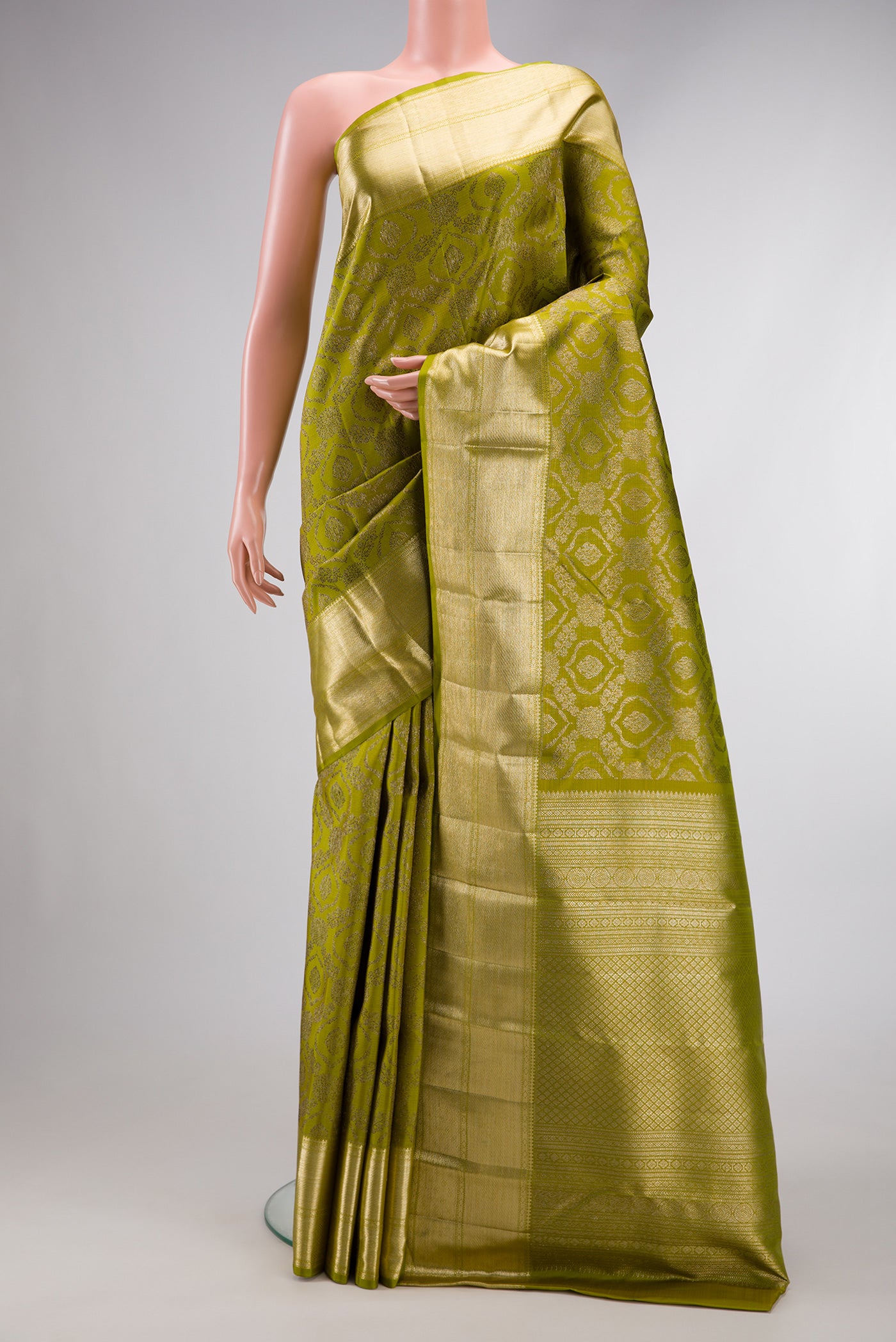 Mehandi Green Dual Tone Kanchipuram Silk Saree with Zari Brocade on the body and Zari Border.  displayed on a mannequin