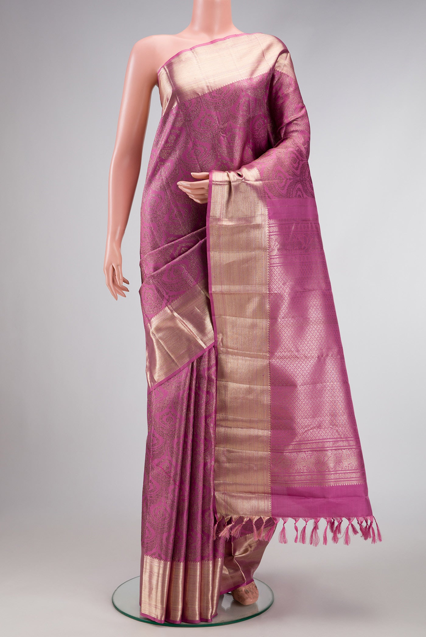 Pink Dual Tone Kanchipuram Silk Saree with Zari Brocade on the body and Zari Border.  displayed on a mannequin