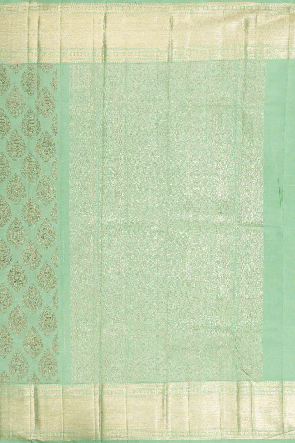 Close up image of the pallu of Light Green Kanchipuram Silk Saree with Zari Brocade on the body and Zari Border. 